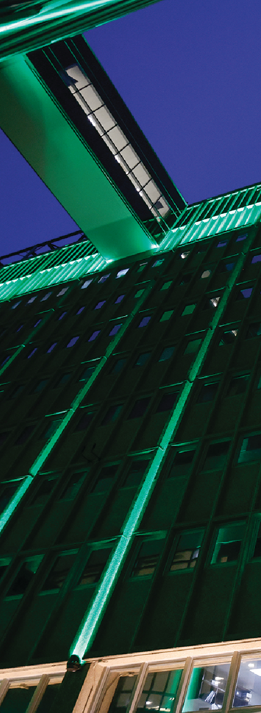Tulane green uplighting on a downtown building.