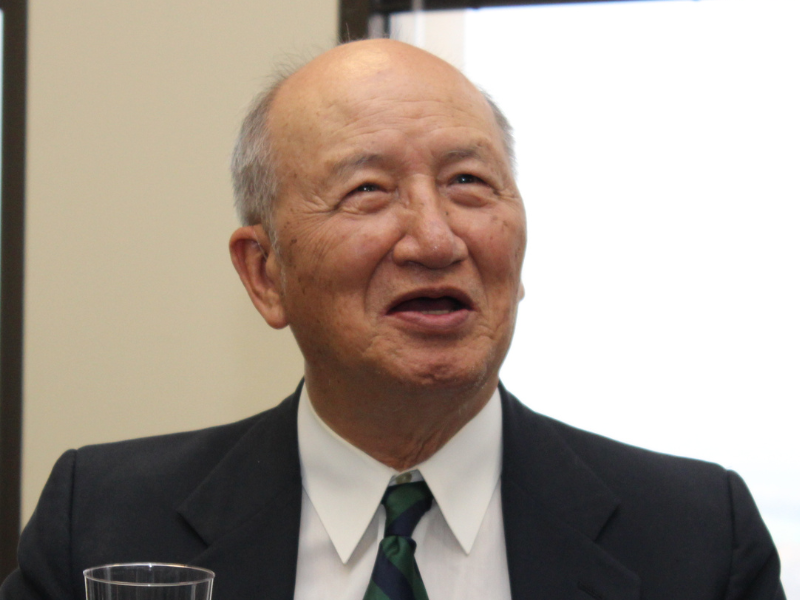 Dr. Ted Chen headshot, smiling, looking at something in the distance