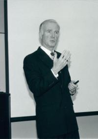 Walter Burnett, black and white photo, lecturing and gesticulating