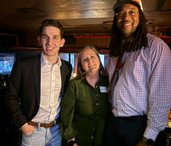 Alumni Director Cait Gladow, center, with alumnus Ben Pincus (left) and alumnus Norbert Lewis (right)